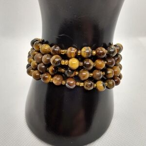2 for $10 Tigers eye 4 strand bracelet. Unbranded. 7.5". Gently used